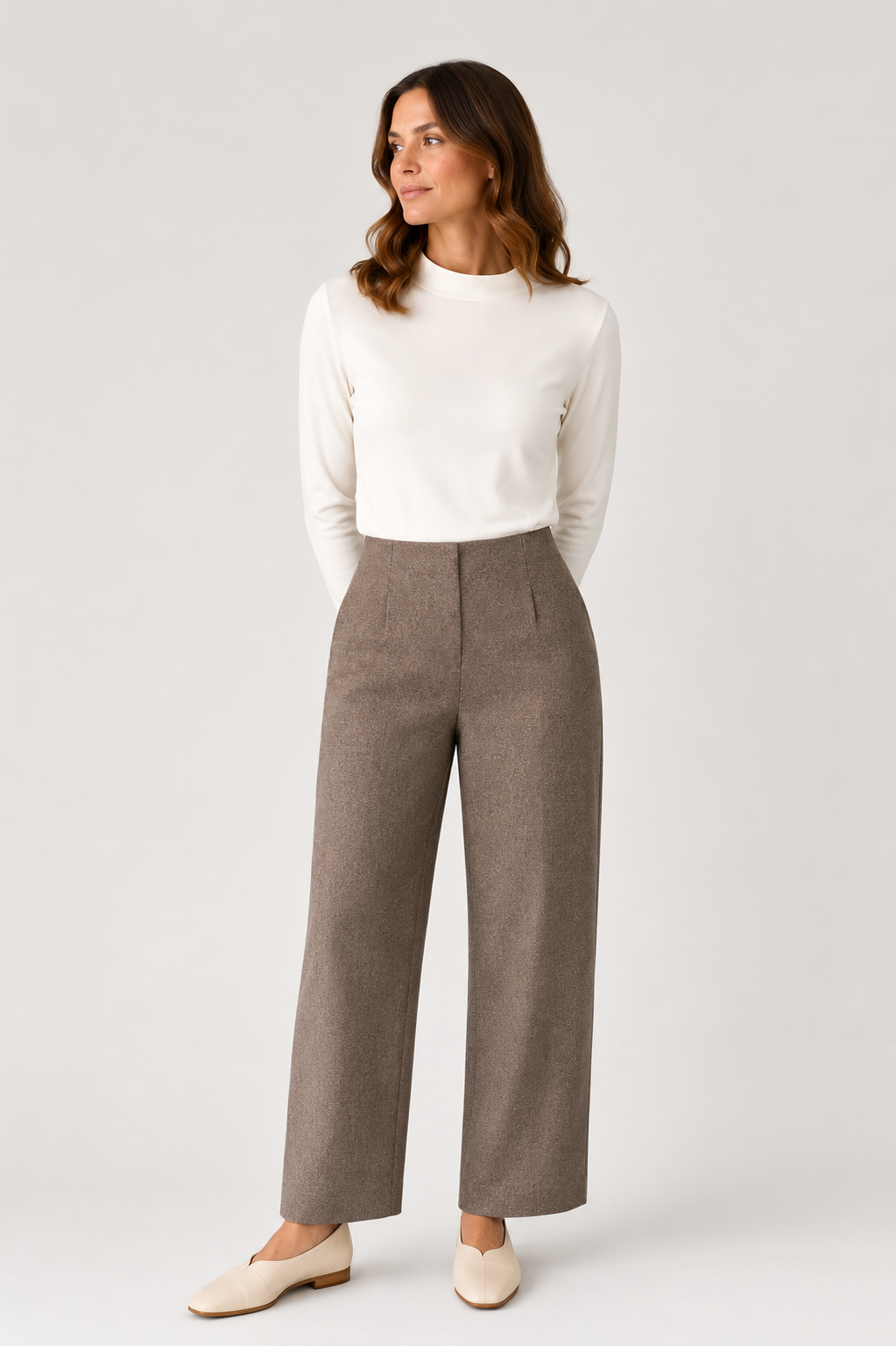Model wearing the Monica Wool Trouser is taupe with the Peta Funnel neck Top